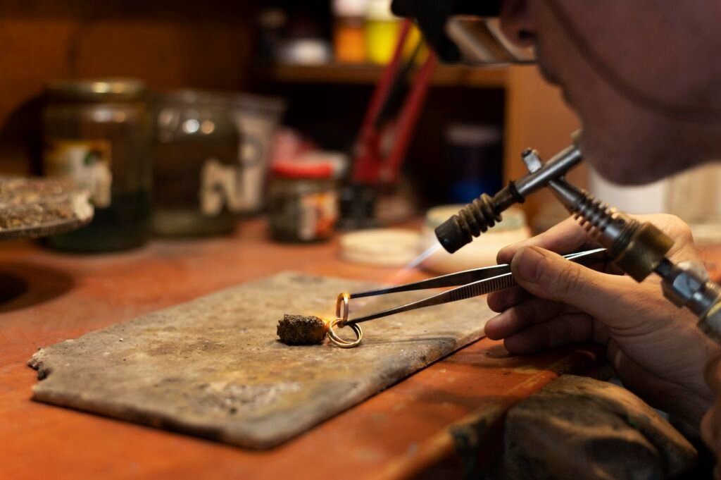 jewelry maker working alone atelier